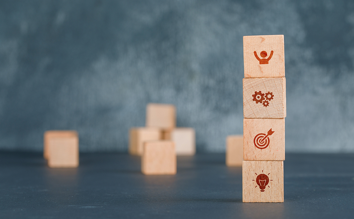 Conceptual of business with wooden blocks column with icons on d